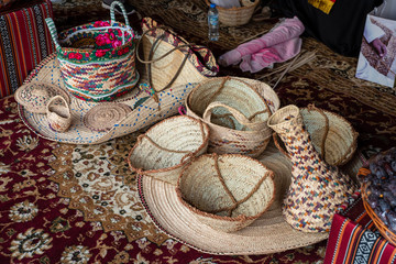 Close up of hand made baskets and matts / baskets and matts made with palm leaves