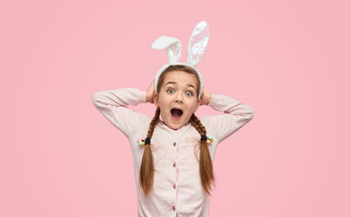 Excited girl in white ears screaming happily