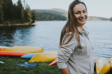 young woman on a boat near lake