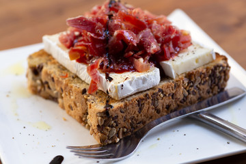 Serrano ham toast, brie cheese and tomato marmalade.