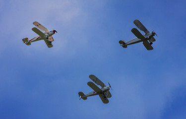 Three Biplanes in Flight