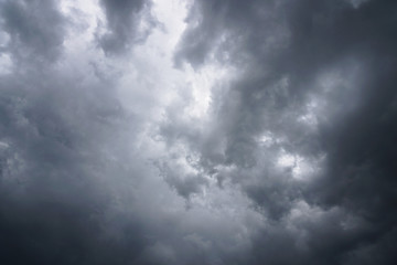 Dark, grim, stormy, rainy sky with rays of light. Scary hurricane clouds. Natural element. Stock...