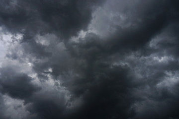 Dark, grim, stormy, rainy sky with rays of light. Scary hurricane clouds. Natural element. Stock...
