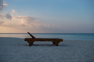 Fototapeta na wymiar a deck chair on the beach