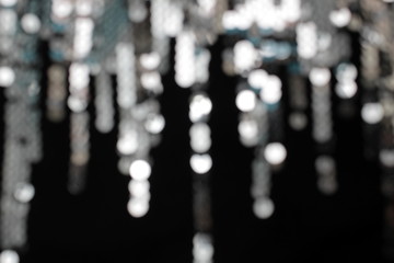 Fototapeta premium Blurred texture gray shiny circles on a black background