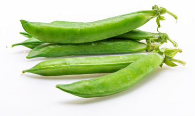 Green, tender, fresh and raw peas. Isolated on white background.