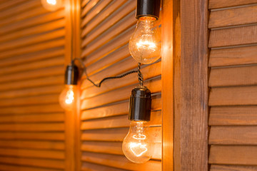 Beautiful retro luxury light lamp decor glowing.Decorative bulbs in vintage style Edison.Garland...