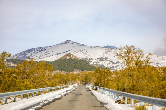 Road to volcano and snow covered Etna Mount, Sicily, Italy