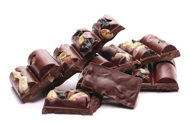 Chocolate bars with blueberries, hazelnut, almonds isolated on white background