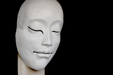 White mask with peaceful expression