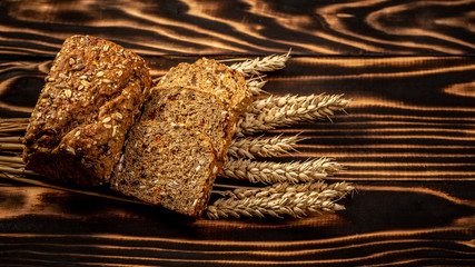 Gluten free food. Various bread with seeds of goji berry on wooden background from top view. Healthy and diet concept
