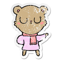 distressed sticker of a peaceful cartoon bear wearing scarf