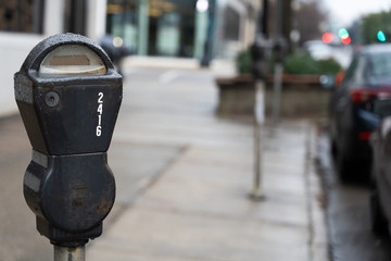 Old style parking meter in the rain