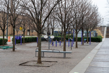 Empty exercise equipment at Railroad Park on a cold, wet, winter day