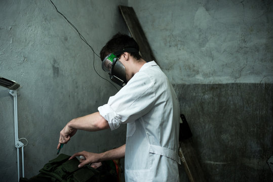 a scientist in a bunker in post-apocalypse