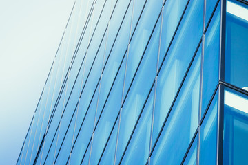 Fototapeta na wymiar Blue skyscraper out of glass, modern office building