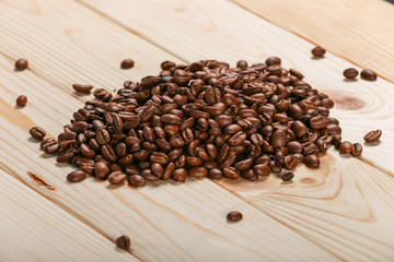 coffee beans on wooden background