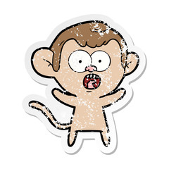 distressed sticker of a cartoon shocked monkey
