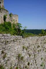 stone wall and castle ruin on top