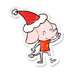 cute distressed sticker cartoon of a elephant wearing santa hat