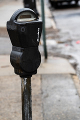 Old style parking meter in the rain