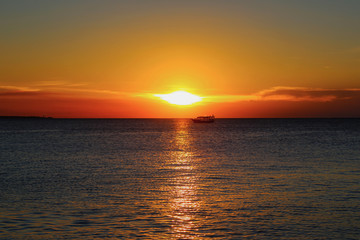 fire sunset and boat
