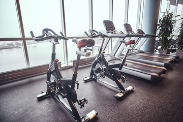 Exercise bikes and treadmills in the fitness center. Sport, fitness, health.