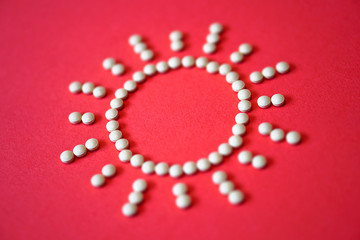 lined sun with rays from tablets and medications. The theme of health and saving lives. ?? ??????? ???? Stock Photography