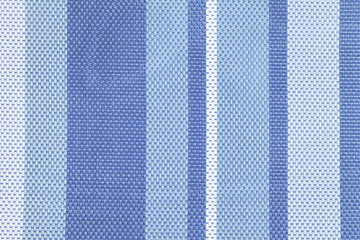 Texture of large weaving close up. Background with light and dark blue stripes. Textile. Photo for...