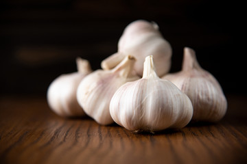 Garlic bulb on the wooden vintage background