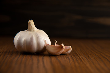 Garlic bulb on the wooden vintage background