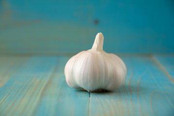 Garlic bulb on the wooden vintage background
