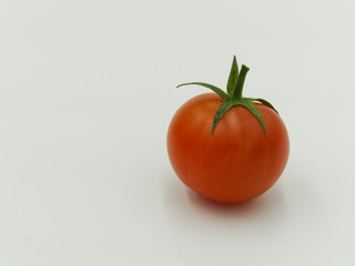 Red cherry tomato isolated on white background