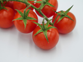 Organic tomatoes isolated on white background