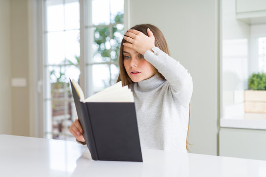 Beautiful young girl reading a book at home stressed with hand on head, shocked with shame and surprise face, angry and frustrated. Fear and upset for mistake.
