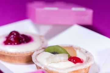 Macro photo of cake with fruit. Cake with a slice of kiwi.