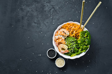 Buddha bowl. Healthy balanced food. Black background, top view, space for text