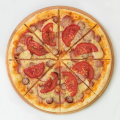 pizza with ham and tomato isolated on white