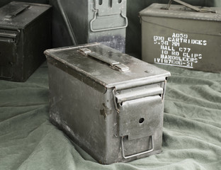 Military green ammunition boxes.