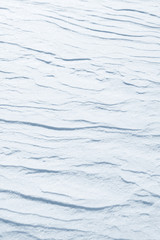 Fresh snow background texture. Winter background with snowflakes and snow mounds. Snow lumps.