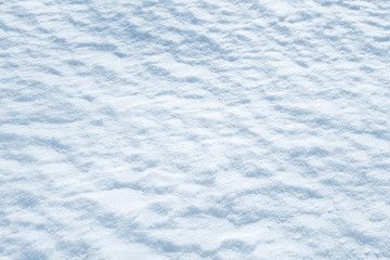 Obraz premium Fresh snow background texture. Winter background with snowflakes and snow mounds. Snow lumps.