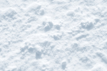 Obraz premium Fresh snow background texture. Winter background with snowflakes and snow mounds. Snow lumps.