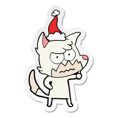 sticker cartoon of a annoyed fox wearing santa hat