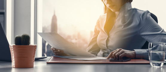Business executive checking financial reports in the office