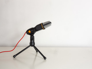 Microphone on a white table.
