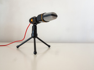 Microphone on a white table.