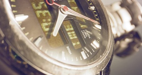 Macro footage of a hand watch with the seconds hand ticking
