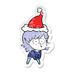 distressed sticker cartoon of a elf girl staring and crouching wearing santa hat