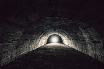 Light in end concept. Underground concrete tunnel or corridor of abandoned nuclear bunker or...