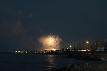 Fototapeta na wymiar Fireworks at Louma Beach at in Pernera, Cyprus on June 16, 2018. 